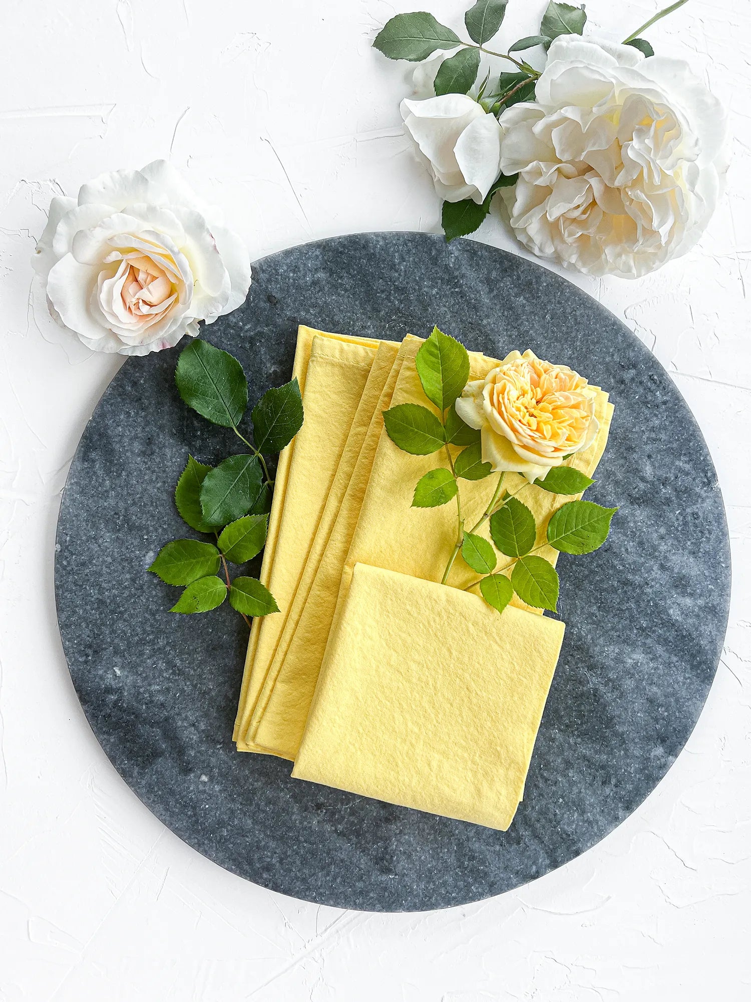 Yellow cotton handmade napkins set on plate